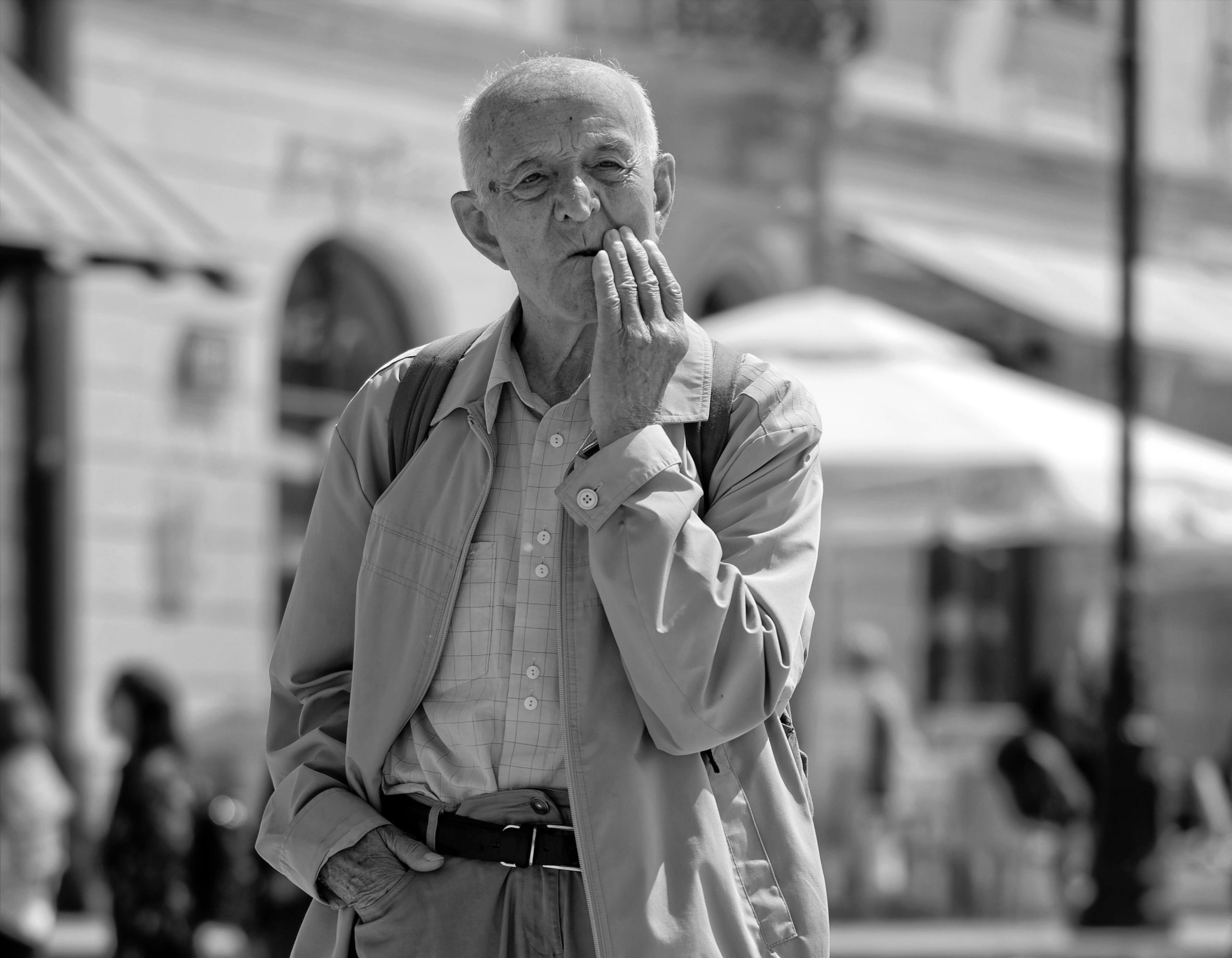 ”man-old-confused-angry-thinker-street-in-the-age-people-tourists.jpg” by unknown is in the Public Domain Photo showing older man with hand near mouth