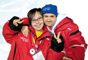 "22605761265_9f8e65a7ad_k.jpg” by Special Olympics 2017 is in the Public Domain Image of two special Olympic athletes