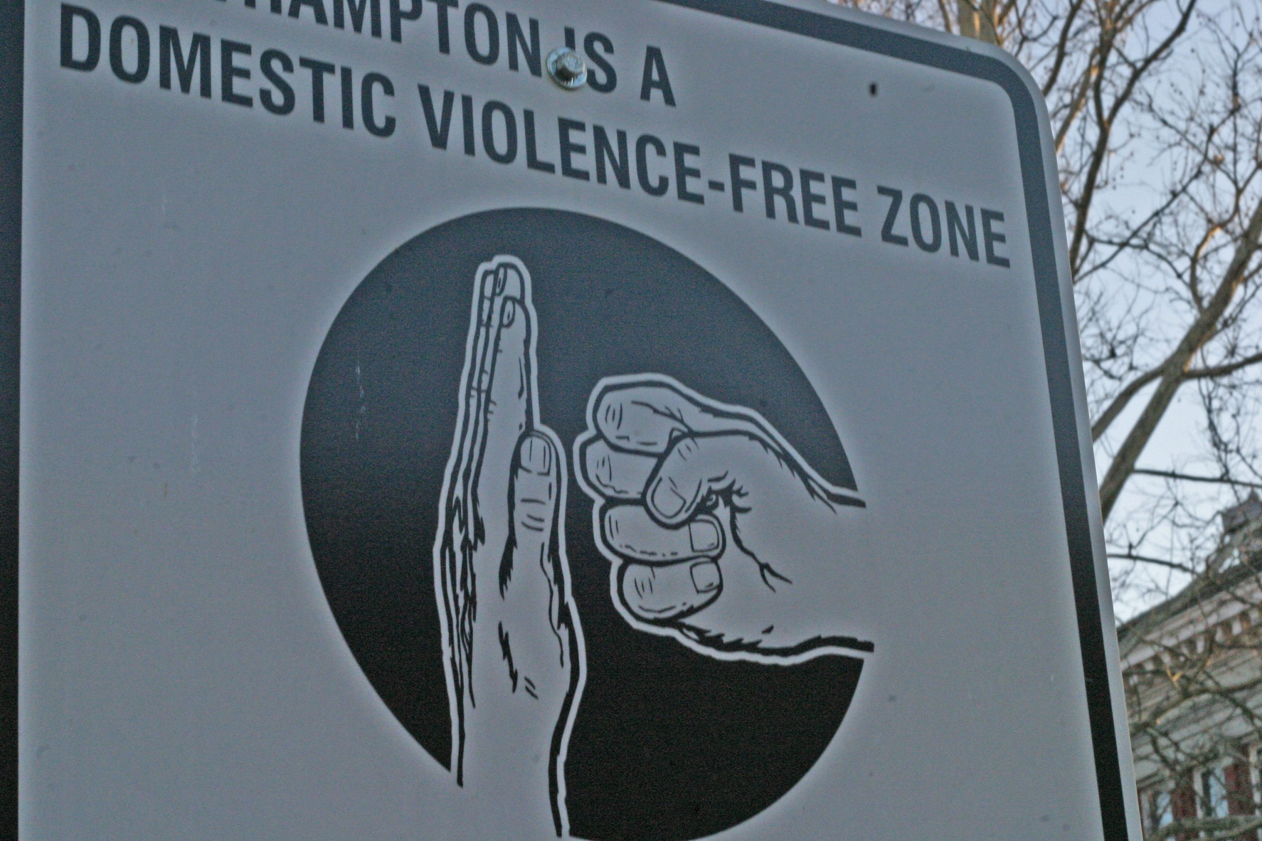 “Domestic_violence_free-zone.jpg” by Ben Pollard is licensed under CC BY-SA 2.0 Photo showing community sign against domestic violence