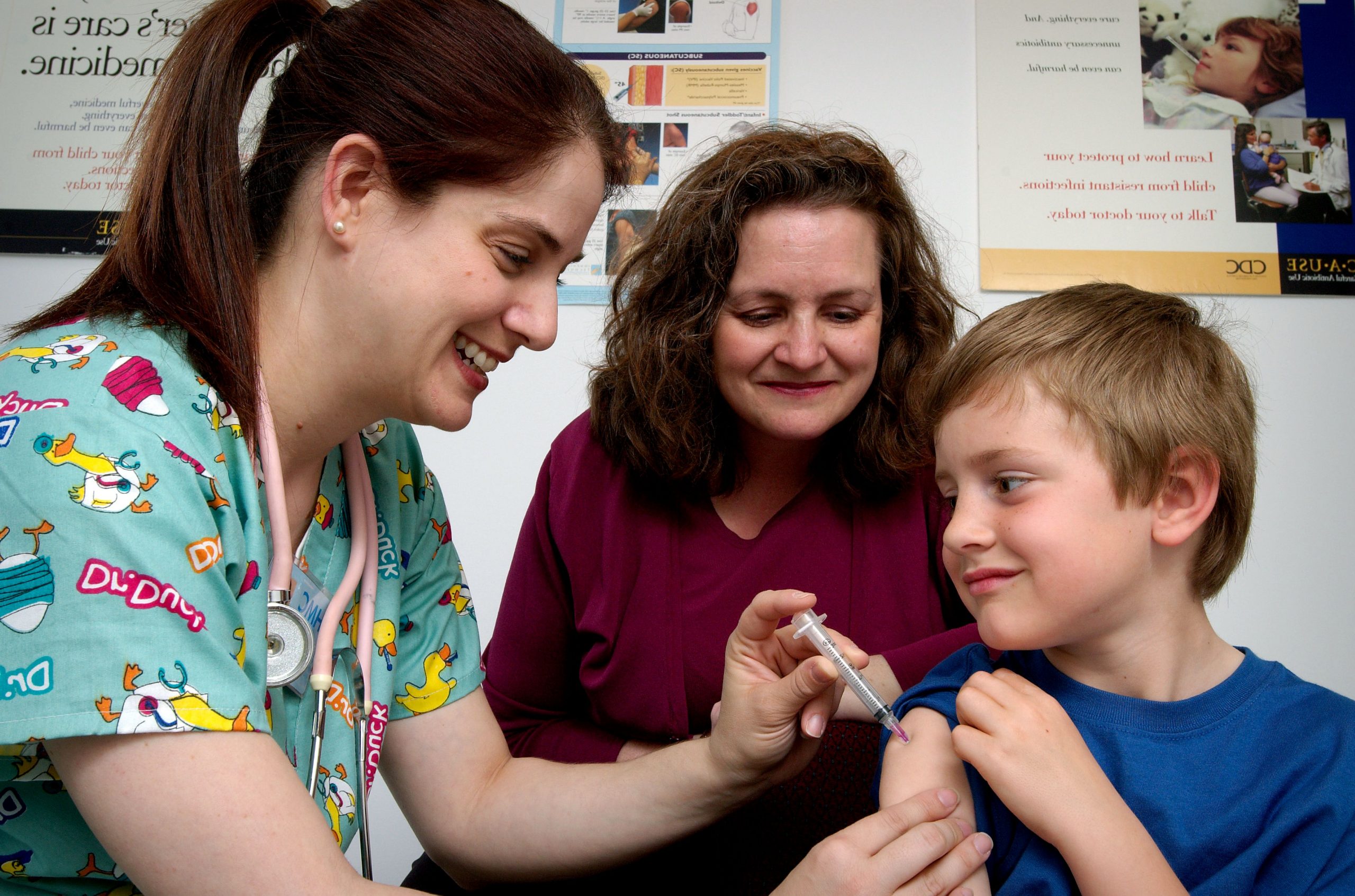 PIXNIO-42752-4542x3003.jpg“ by James Gathany, Judy Schmidt, USCDCP is in the Public Domain Photo showing nurse administering an injection to a young patient