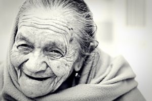 "woman-1031000_960_720.jpg" by Free-Photos is licensed under CC0 Image of an elderly woman smiling