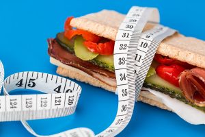 Image of a sandwich with a measuring tape wrapped around it