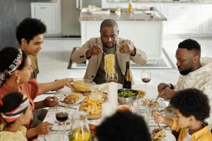 Image of a family  sitting down to a meal together