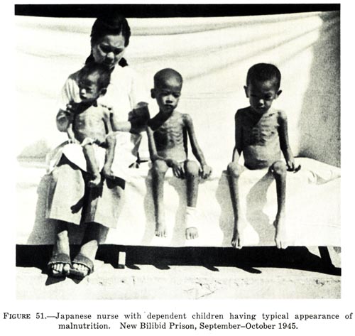 Japanese nurse with dependent children having typical appearance of malnutrition, New Bilibid Prison, September-October 1945