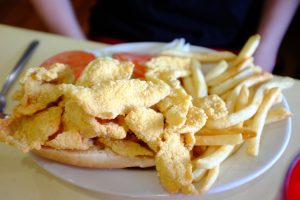 Image of a plate of fried catfish and french fries at Middendorf's Restaurant in Louisiana.