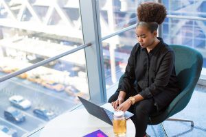 black lady working a laptop