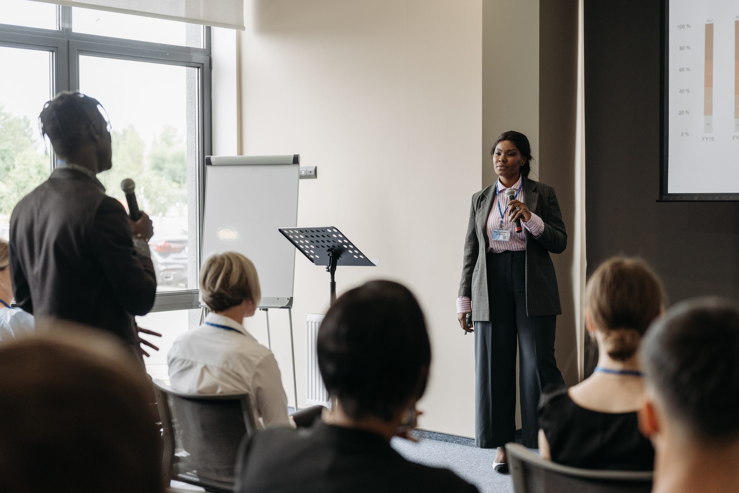 person asking a question during presentation