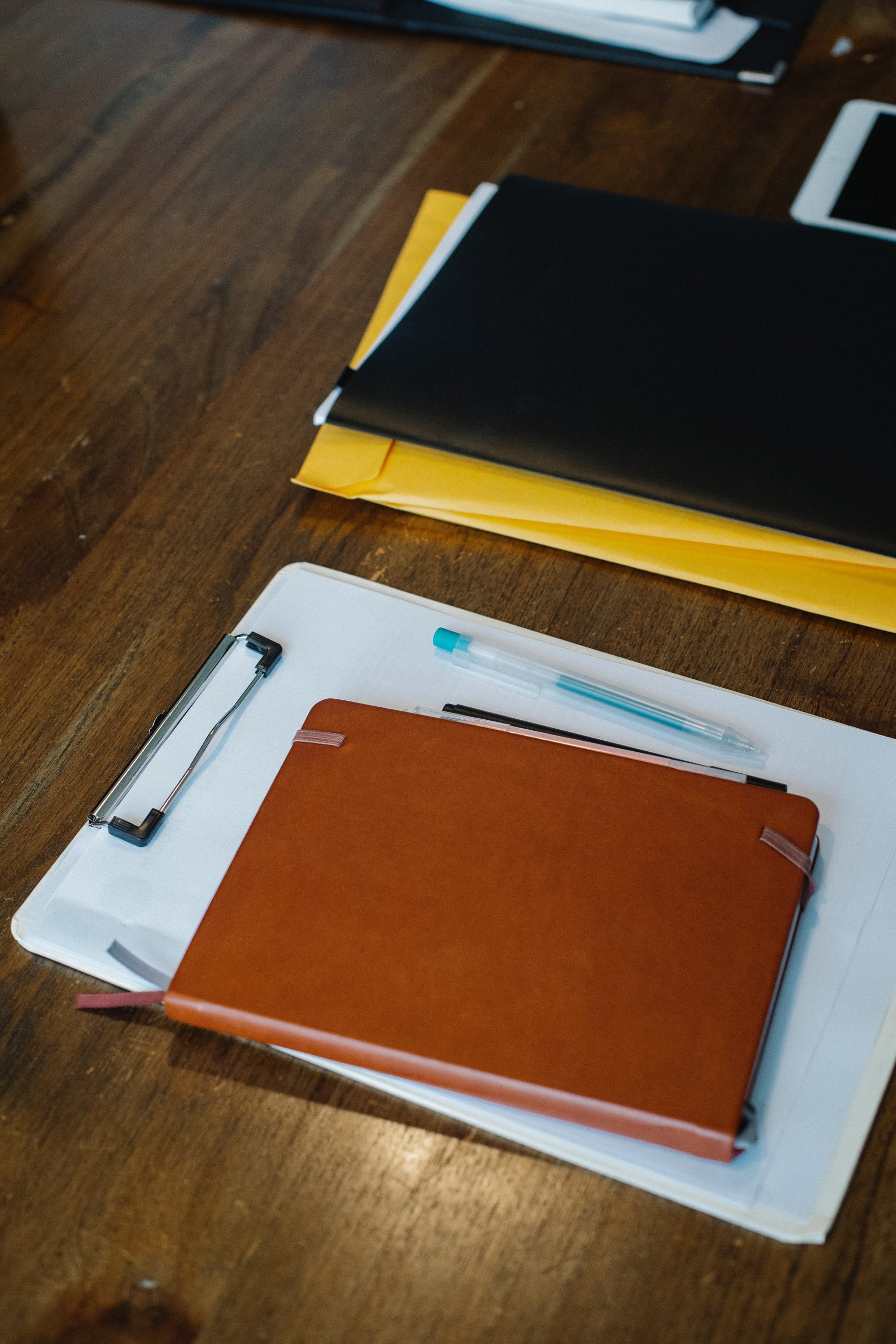 notepads and binders on a table