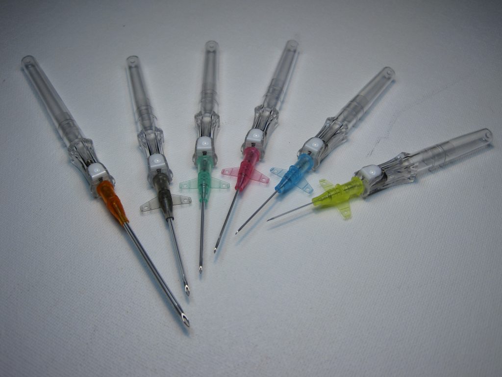 Six IV catheters of varying sizes