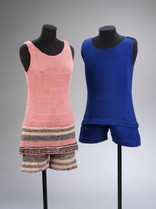 Two costumes, one pink with striped blue shorts and one blue, created by Coco Chanel. T