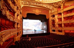 A photograph of the stage at the Garnier Opera House.