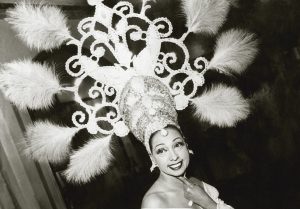 Black and white photo of Josephine Baker in an elaborate headdress