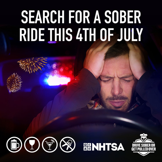 A picture of a man being pulled over for Drunk Driving.