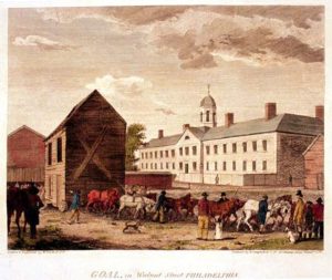 A historical illustration of an urban street scene in Philadelphia with people, horses, and buildings.