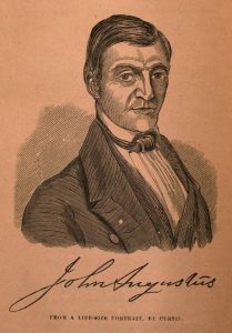 Illustration of a man in formal attire with signature below.