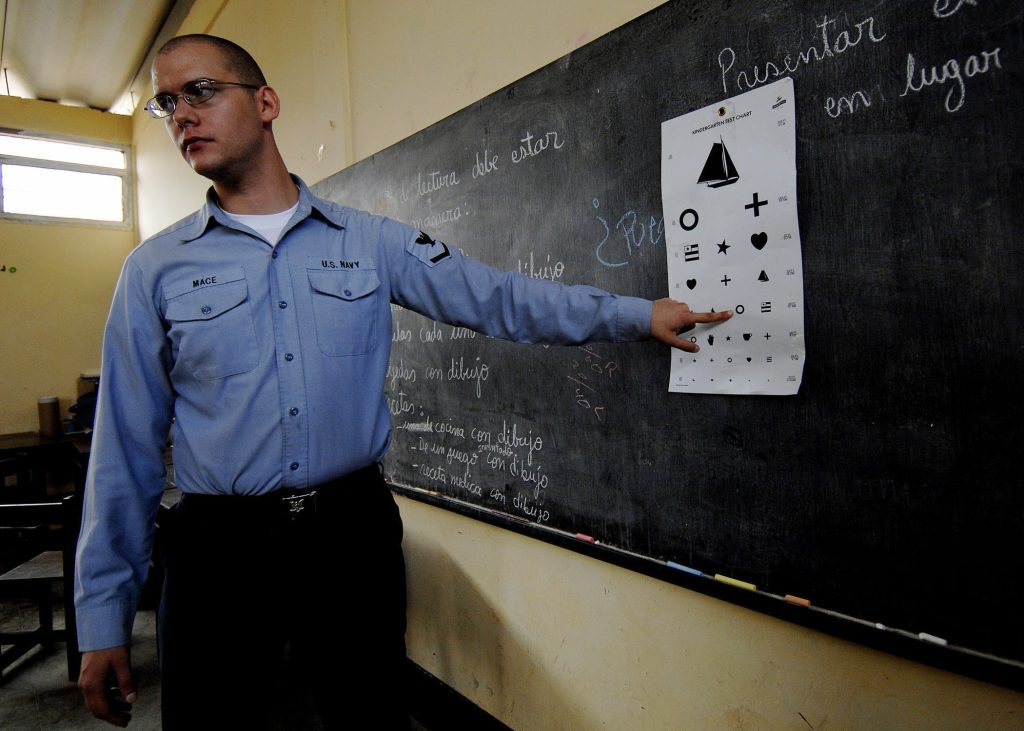 Photo of an optician using an alternative eye chart. 