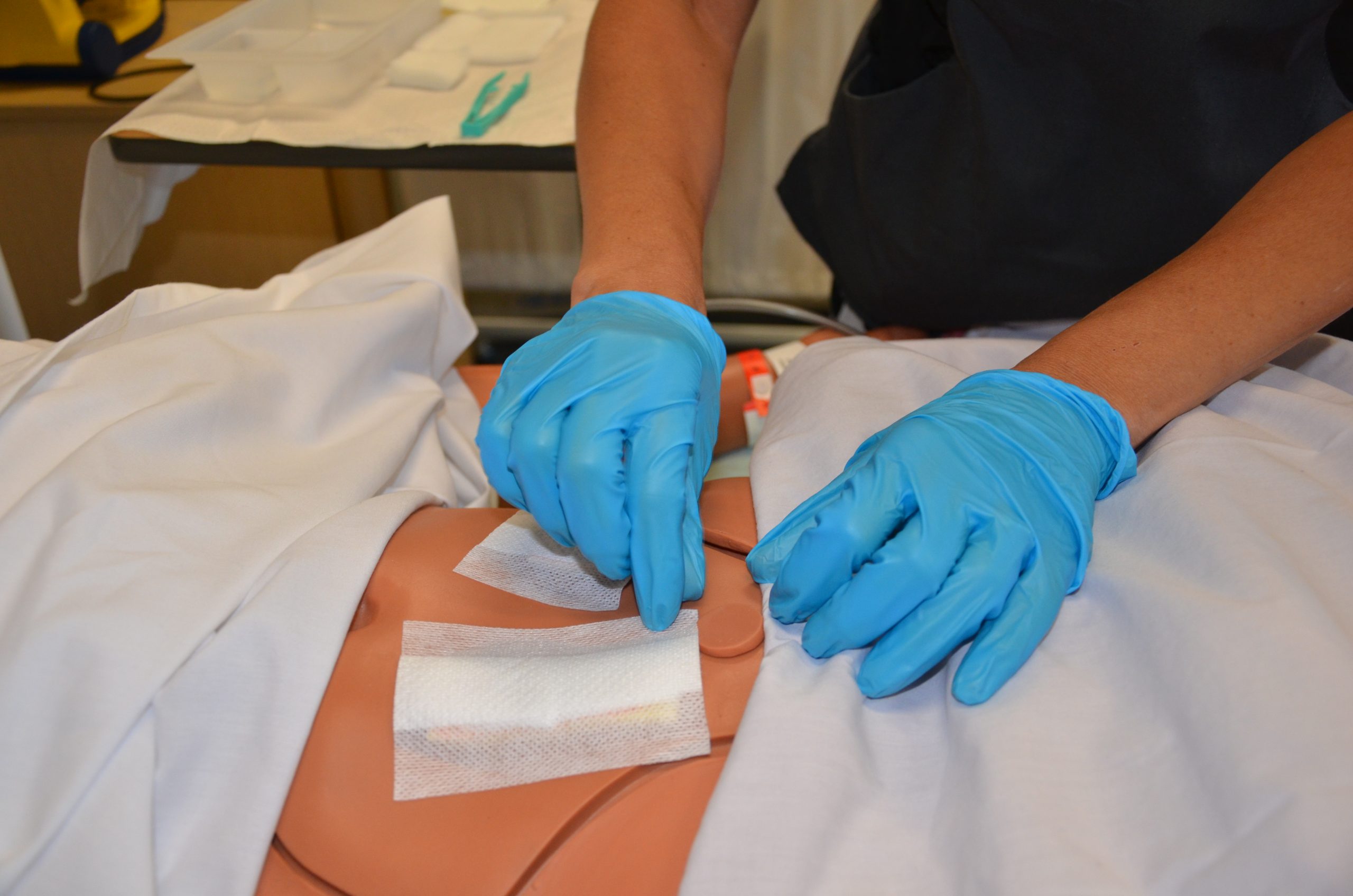 Removing outer dressing with non-sterile gloves