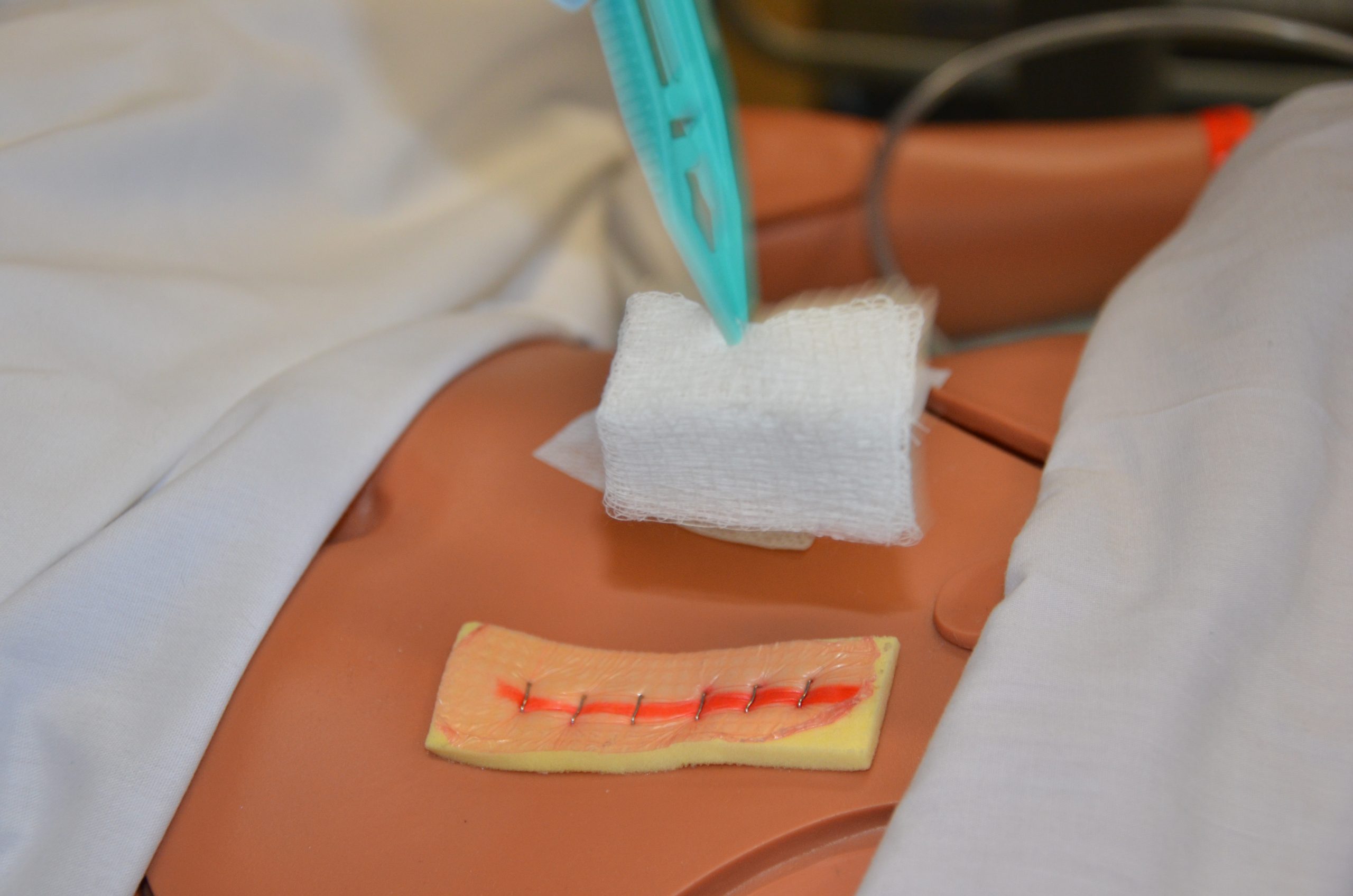 Remove inner dressing with forceps