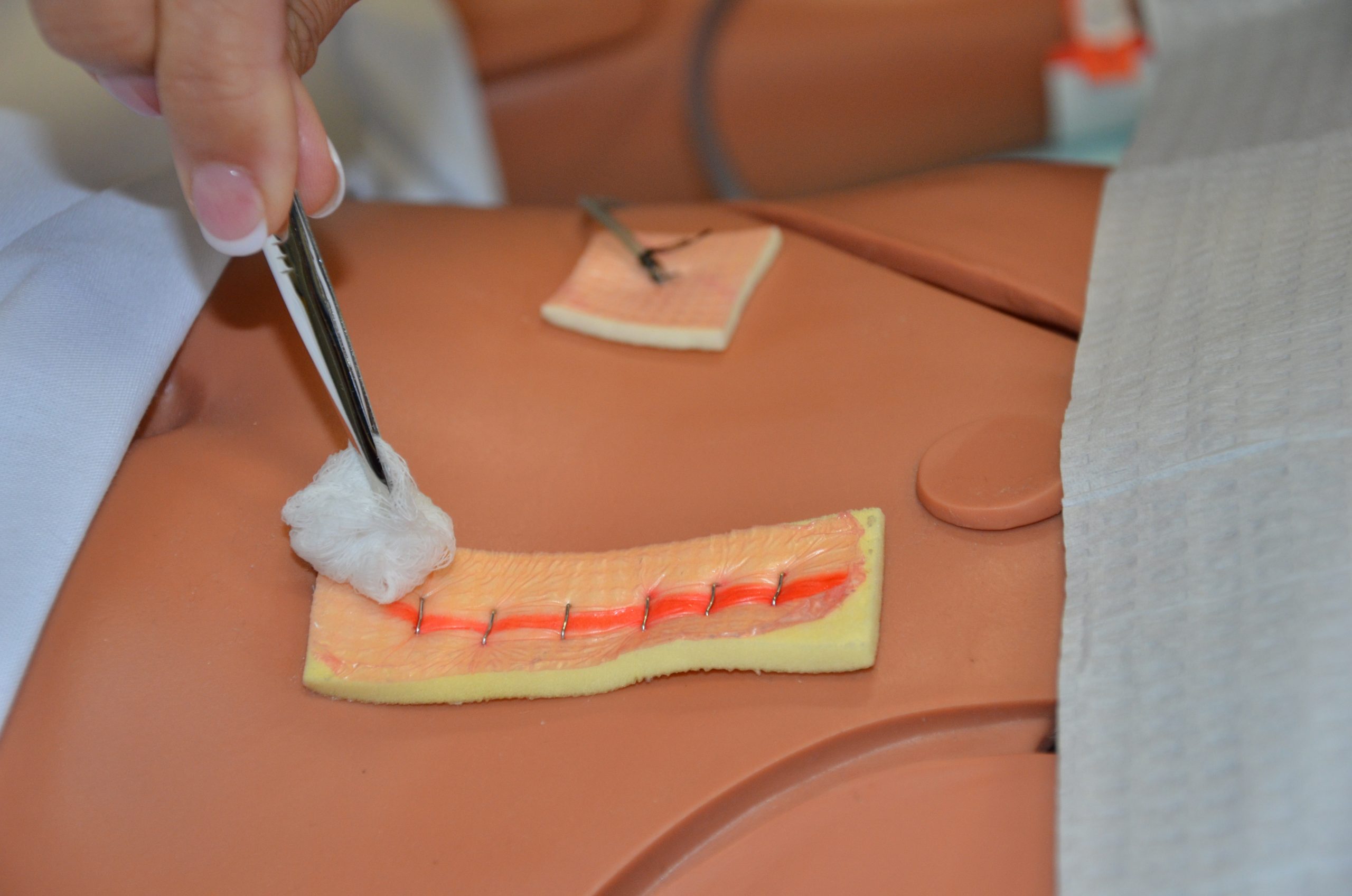 Work in straight lines, moving away from the suture line with each successive stroke.