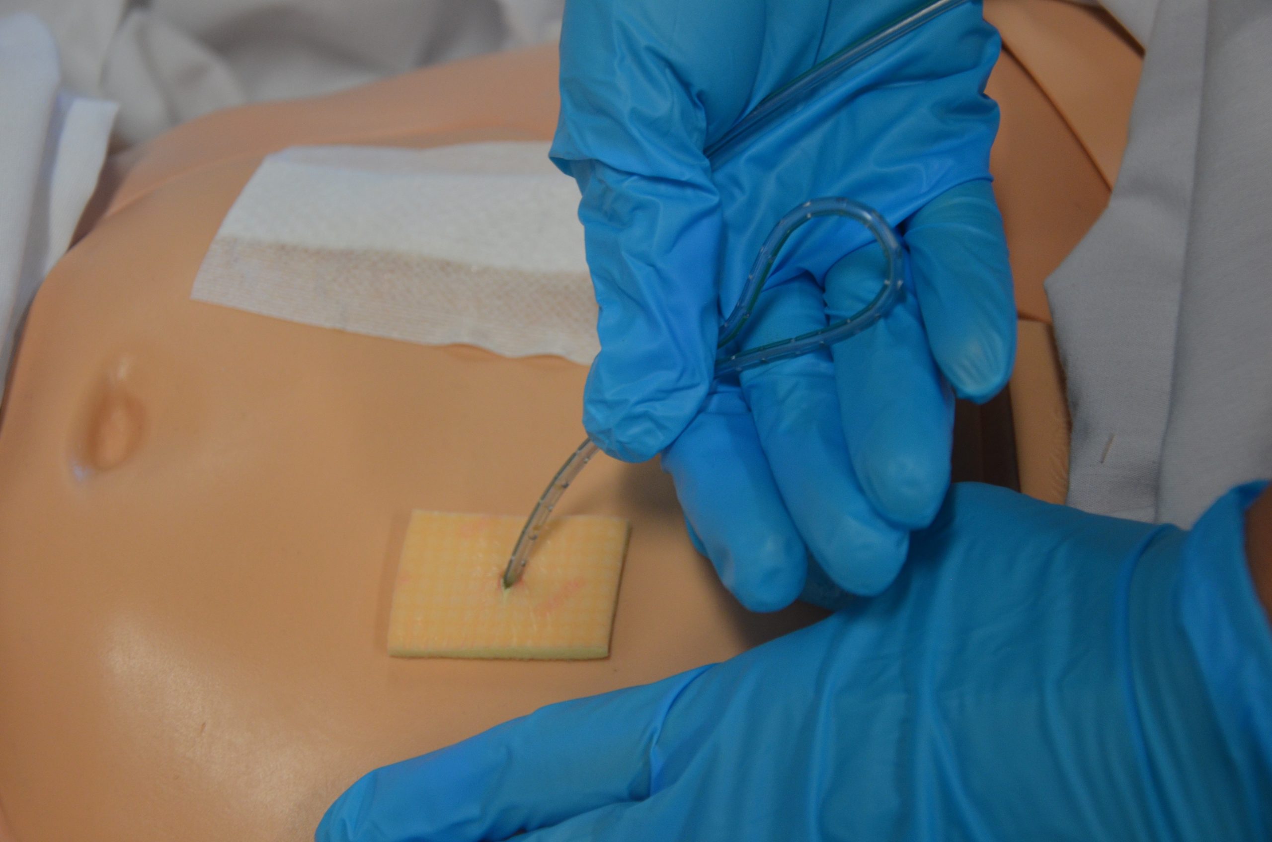 gather drain tubing in your hand as it's being removed