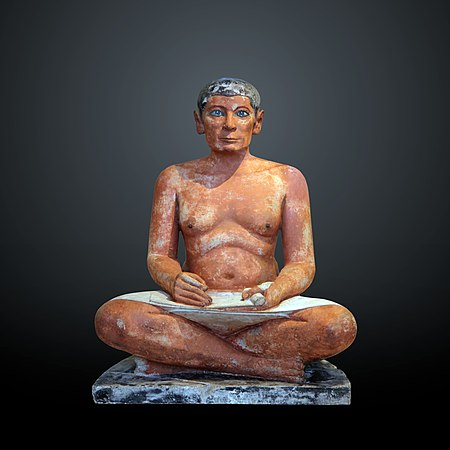 A man seated cross legged in limestone
