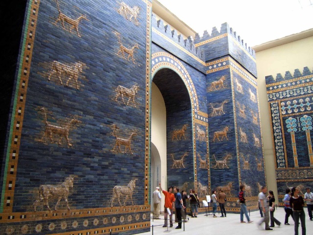 Side view of wall of gates with animals on the front