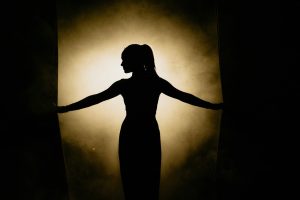 A lady standing in silhouette
