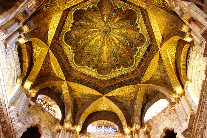 The ceiling of Mosque that is gold and painted with art