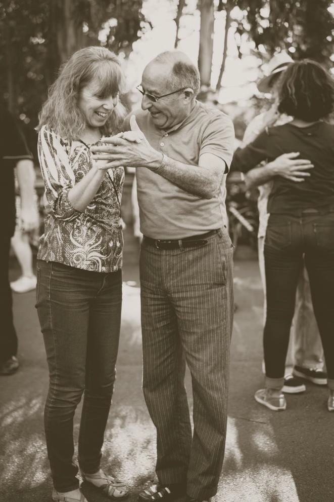Two people dancing while smiling