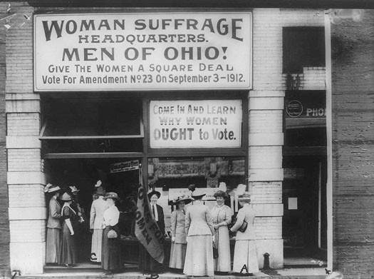 Several women outside of the Woman Suffrage Headquarters.