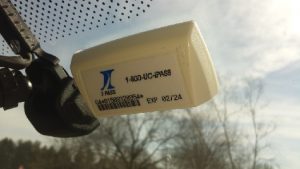 E-Z Pass attached to the inside of a car windshield.