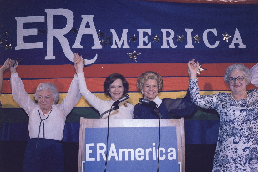 Rosalynn Carter and Betty Ford speaking at a rally in favor of the Equal Rights Amendment.