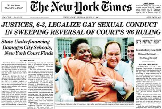 Front page of the New York Times newspaper showing three people embracing.