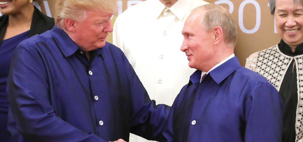 Donald Trump and Vladimir Putin shaking hands.