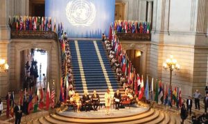 Nancy Pelosi and several dignitaries at the United Nations Charter.