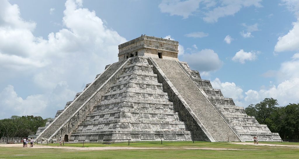 The stone pyramid of Kukulcán in Chichén Itzá with a view of steps on two sides of the pyramid leading up to the top