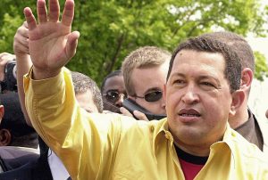 Hugo Chavez with hand extended in wave