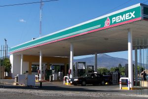 Man fills up car at Pemex gas station in Mexico
