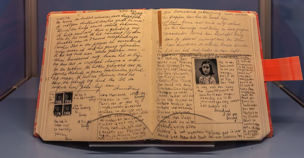 Handwritten diary by Anne Frank with photographs of Anne integrated into text