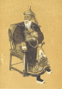 Commissioner Lin Zexu with long beard, hat, and traditional clothing seated in a chair