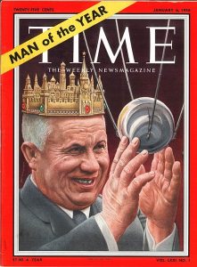 Nikita Khrushchev on the cover of Time magazine holding Sputnik in his hands and wearing a crown styled like the Kremlin with headline on cover that reads "Man of the Year"