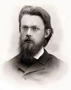 Photographic portrait of a young Verndansky with beard and wearing glasses