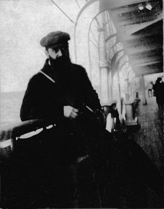 Theodor Herzl leaning against a bannister on board a ship