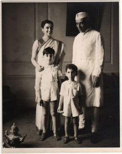 Photographic portrait of Indira Gandhi, her father, and her two small children (with her hands on the shoulder of older son)