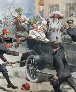 Gavrilo Princip in foreground pointing gun at Archduke Franz Ferdinand and his wife in an open top car while military personnel react to the shooting