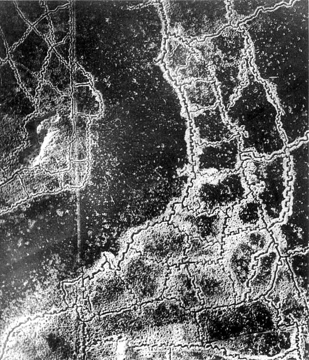 Aerial view of opposing trench lines that cover the landscape in thick lines with German trenches at the right and bottom and British at the top-left