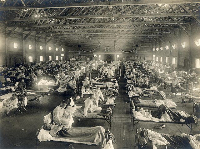 Entire room with beds full of patients in an emergency hospital in Camp Funston, Kansas, in the midst of the influenza epidemic.