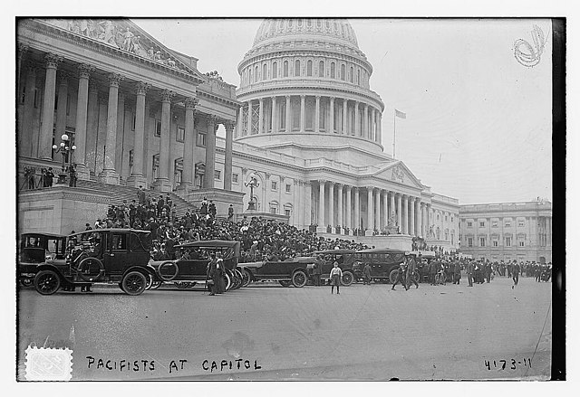 Numerous anti-war protestors and their cars in front of the U.S. Capitol