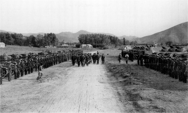 Group of soldiers walk among Soviet armored fighting vehicles during a Review of these vehicles that were used to equip the Republican People's Army during the Spanish Civil War