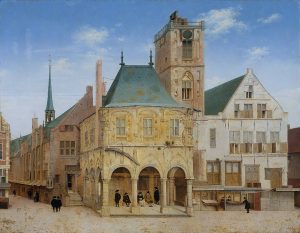 View of the old Town Hall in Amsterdam, a two-story building with open pathway on first floor and people seated in 17th century garb; other buildings appear to be connected to the old Town Hall and people can be seen walking around